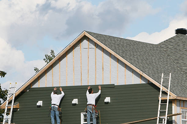 Professional Storm Damage Siding Repair technician working in Northfield, OH